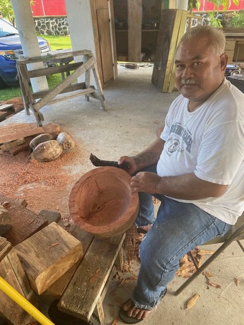 A woodcarver at work in American Samoa
