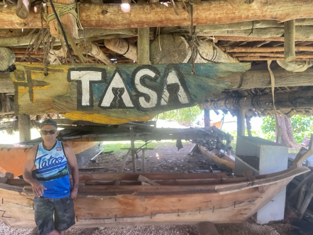A canoemaker with his vessel on Guam, preparing for FestPAC